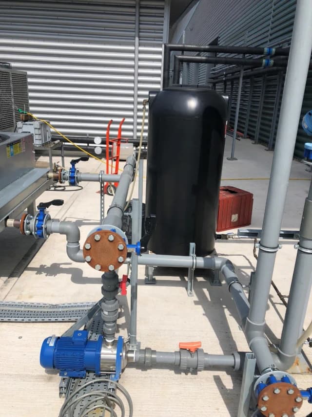 Custom designed cooling system with buffer tank and professional piping installation