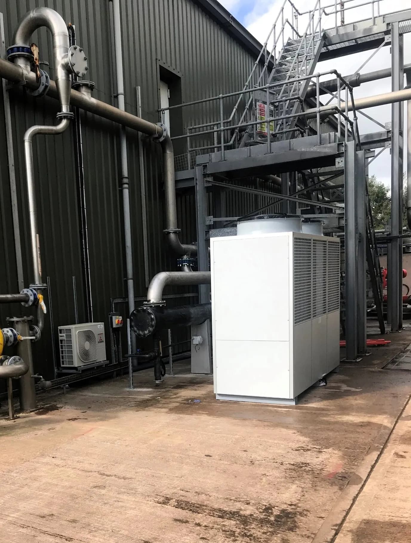 Large-scale industrial chiller installation with complex piping infrastructure