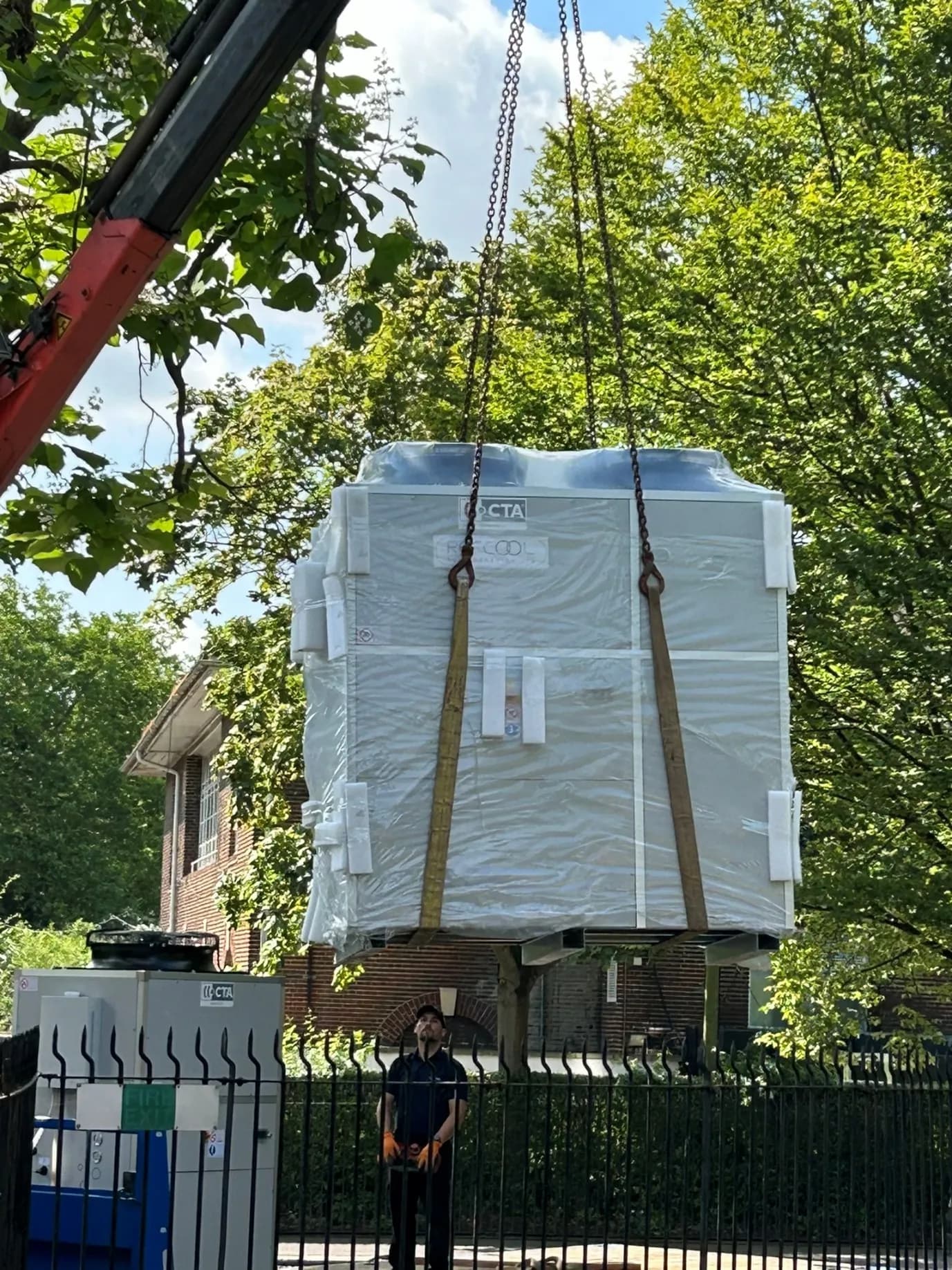 Refcool team installing industrial chiller with crane