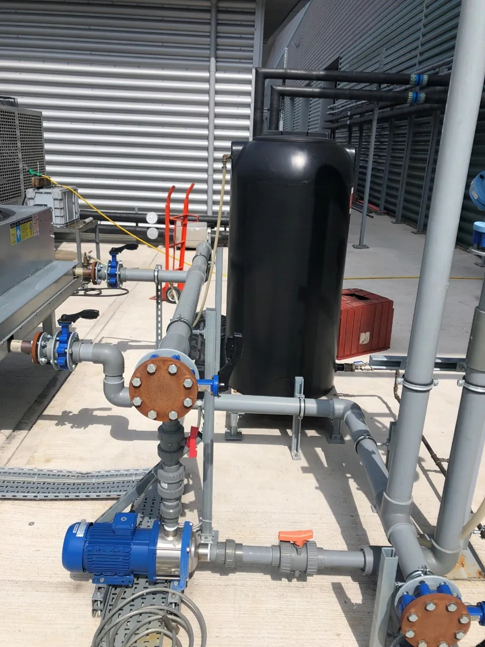 Custom designed cooling system with buffer tank and professional piping installation